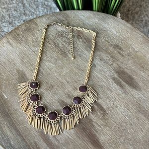 Gold and wine colored statement necklace.